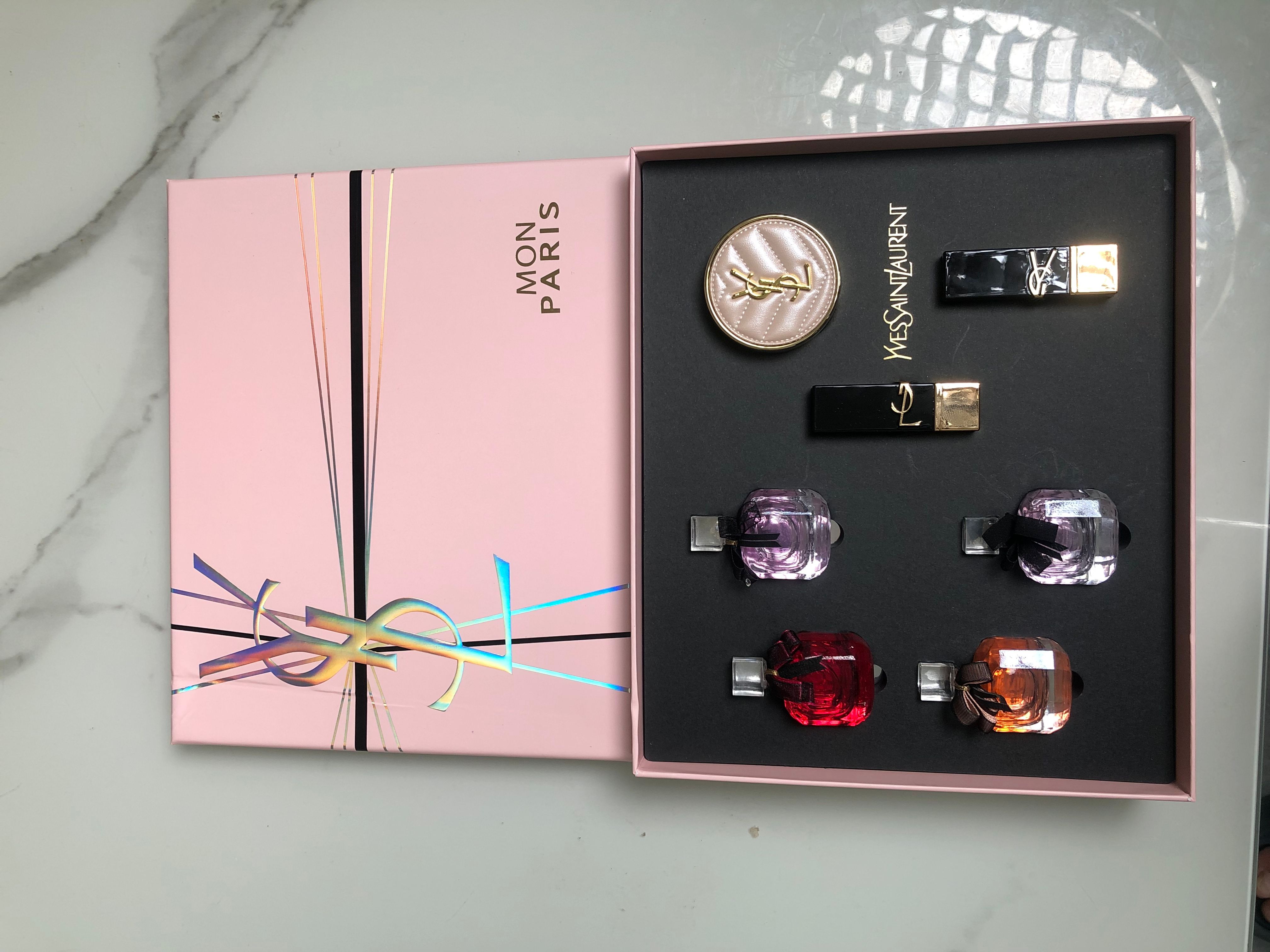 Gift-set product photo — US-264 — Catalogue name: Yves Saint Laurent Mon Paris 7-Piece Mini Gift Set — Capacity shown: As pictured: perfumes 7.5ml × 4; lipsticks 1.3g × 2; cushion 5g