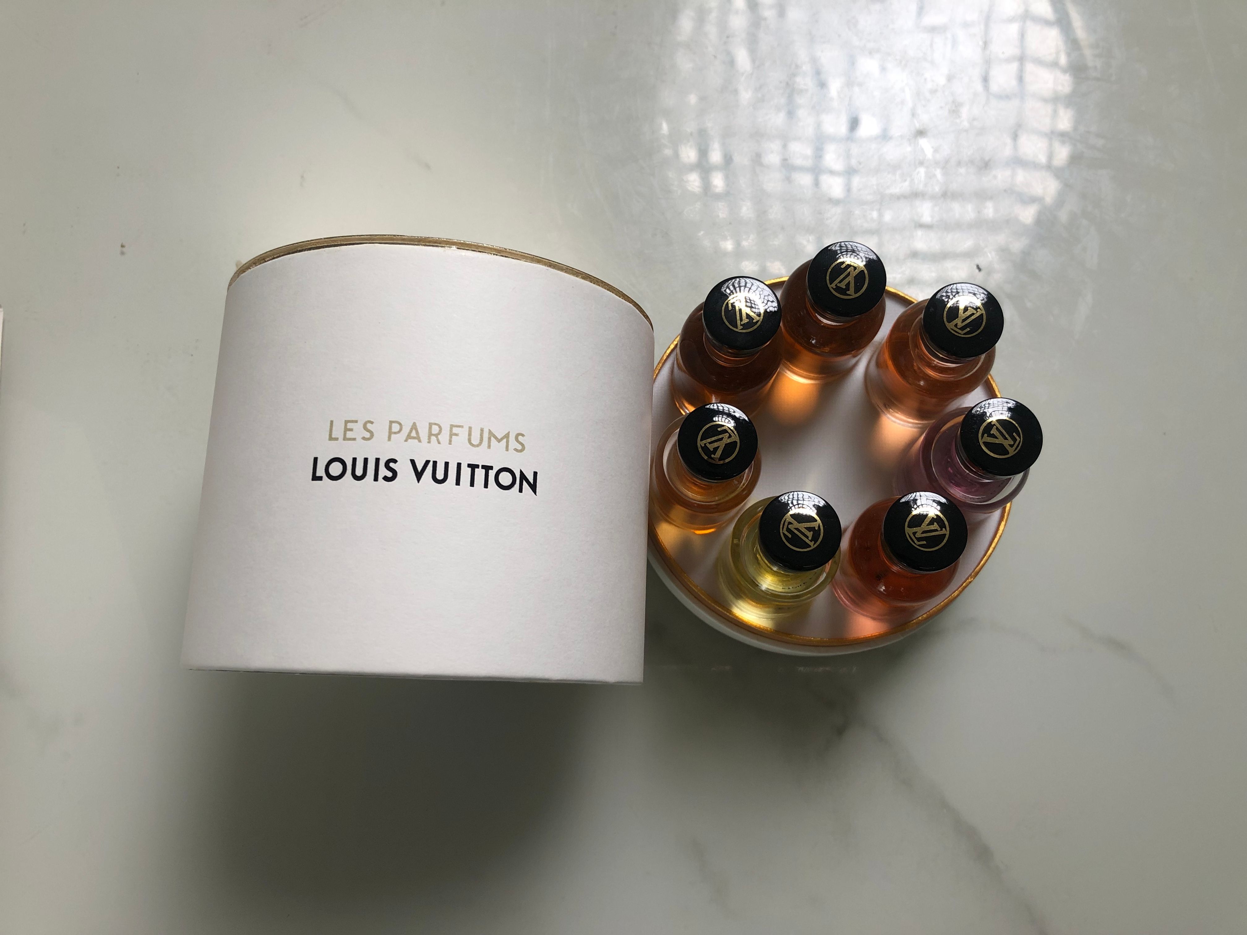 Gift-set product photo — US-283 — Catalogue name: Louis Vuitton Les Parfums 7-Piece Mini Perfume Gift Set Cylinder Box — Capacity shown: 10ml × 7